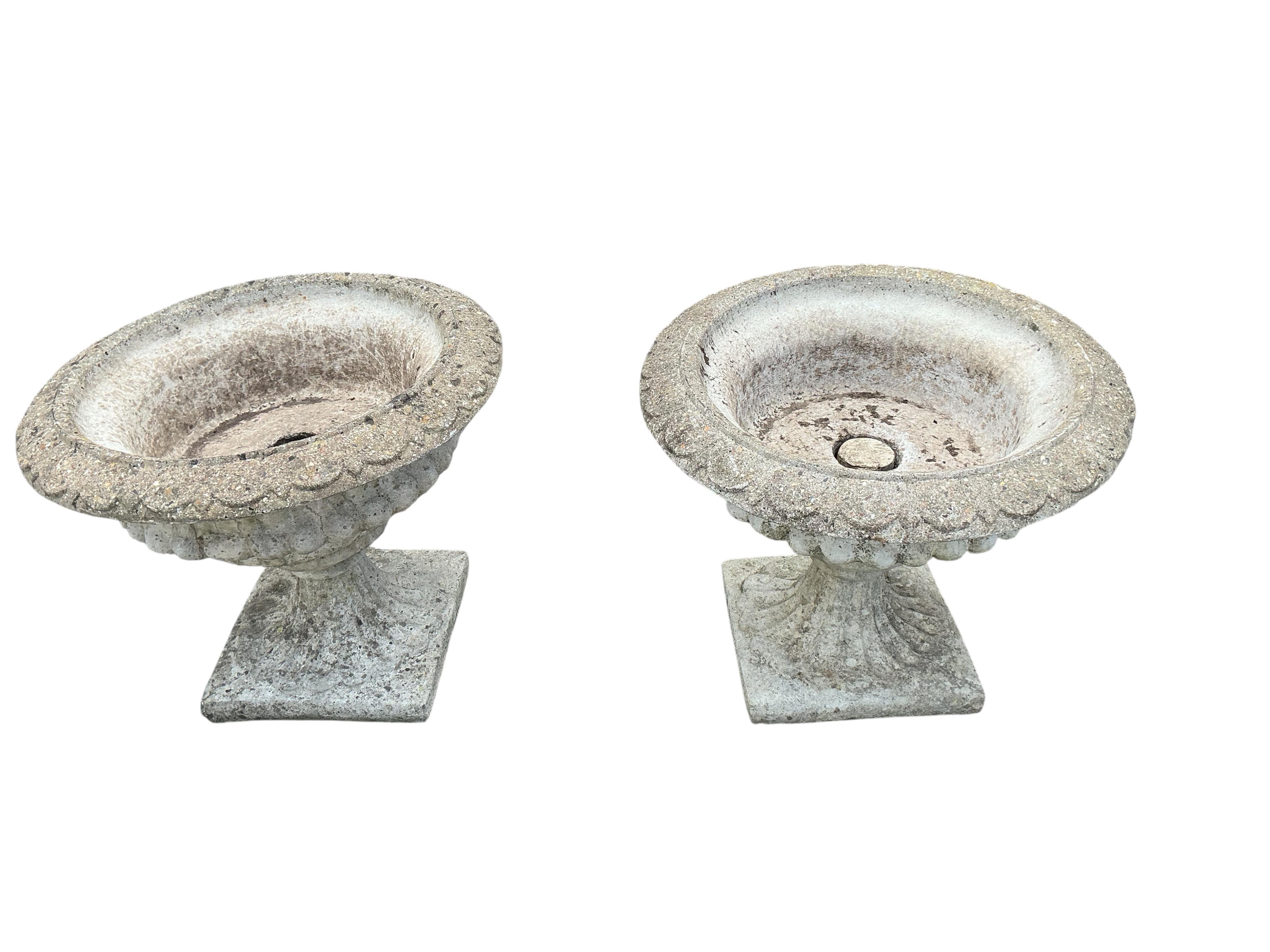 A pair of circular reconstituted stone campana garden urns, diameter 61cm, height 53cm